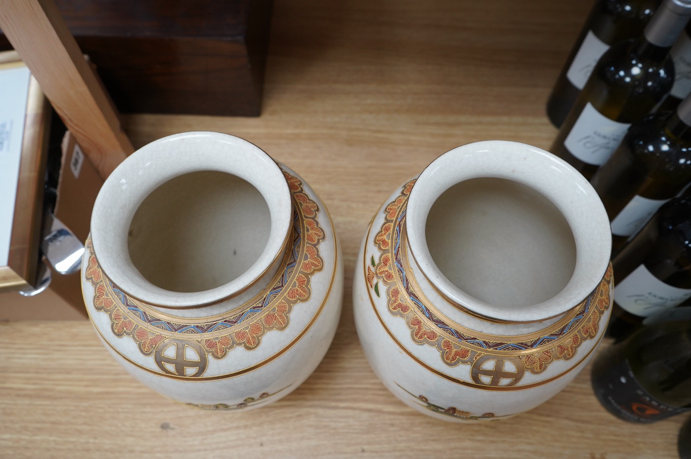 A pair of 20th century Japanese satsuma pottery vases, 32cm high. Condition - crazing throughout